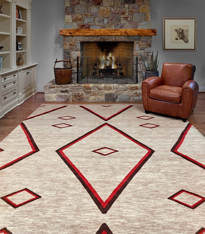 Living room with fireplace leather chair and tan and red area rug